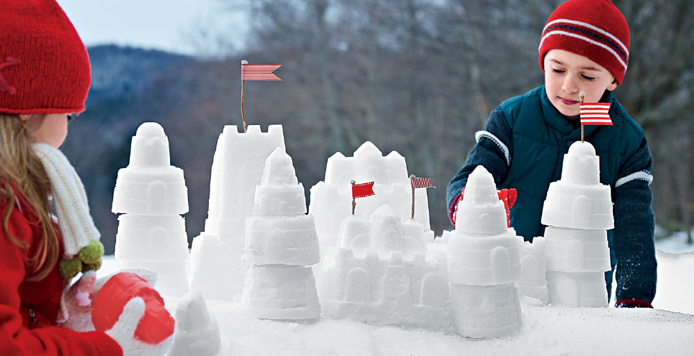 Children building snowcastle